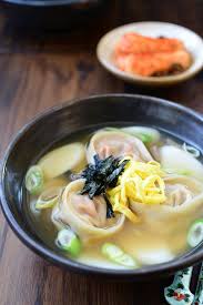 Tteok Mandu Guk Rice Cake Soup With Dumplings Recipe Rice Cake Soup Rice Cakes Food