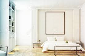This distance gives you plenty of room to move between the coffee table and the sofa while keeping items on the table within reach. Front View Of A White Bedroom Interior With A Double Bed A Coffee Stock Photo Picture And Royalty Free Image Image 79425654