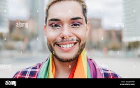 Wearing rainbow flag hi-res stock photography and images