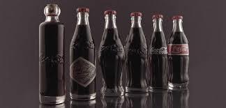 Push down on the handle to pry the bottle cap off of the bottle. The History Of Our Contoured Bottle Coca Cola History Coca Cola Gb