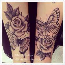 Butterfly knife and black rose tattoos. 37 Inspiring Butterfly And Rose Tattoos