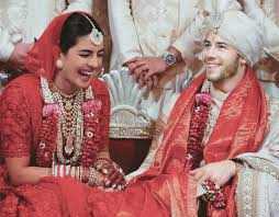 Bollywood actress priyanka chopra (l) and us musician nick jonas (r) pose for photographs during a reception in mumbai, india, 19 december 2018. 17 Things We Loved About Priyanka Chopra Nick Jonas Wedding The Urban Guide