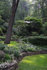 Simple Sloped Garden In The Woods Love The Stone Wall Beautiful Gardens Sloped Garden Landscape Design