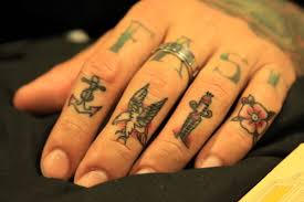 Knuckles tattoo tribal arm tattoos tattoos. Fuck Yeah Finger Tattoos