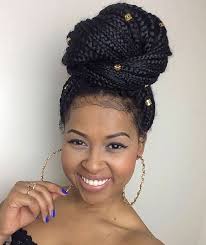 A type of hairstyle, where the hair is pulled back from the face, twisted and wrapped in a circular coil around itself; 23 Exotic Braided Bun Hairstyles For Black Hair