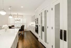The rest of the existing cabinets were stripped and refinished, and the wood doors were replaced with glass insets. Frosted Glass Pantry Cabinet Doors Design Ideas