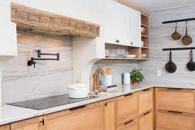 We are having a granite backsplash installed (along w/ the countertops), they made templates, and marked where existing outlets are on the old wall. Granite Vs Marble Pros And Cons Hgtv