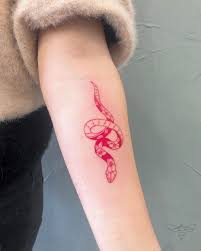 Cosmetic tattoos can be used to cover up scars, enhance eyebrows and lips, create eyeliner or lip liner, and make the face appear more youthful. Jmunz On Instagram Small Red Snake Email For All Bookings Follow Jmunztattoos Red Ink Tattoos Red Tattoos Mini Tattoos