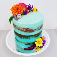 Don't be afraid to place these little floral beauties straight onto your food (assuming you've washed them). Blue Naked Cake With Bright Flowers The Girl On The Swing