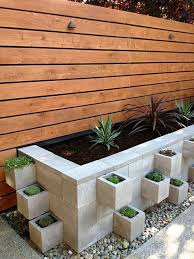 A Way To Plant Flowers That The Dogs Won T Destroy Cinder Block Garden Front Yard Landscaping Backyard Landscaping