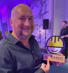 Top plumber uses winnings to help young footballer