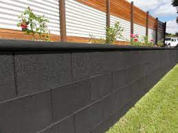 Lay down newspaper or a drop cloth before starting. Diy Freestone Eco Ebony Retaining Wall Blocks Cinder Block Walls Cinder Block Garden Wall Landscaping Retaining Walls