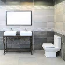 After the tiles are set, you need to add grout gently on the surface with the help of a trowel. Ctm By Accentuating Dark Feature Wall Tiles Your Bathroom Will Gush With Elegance And Never Go Out Of Style Facebook