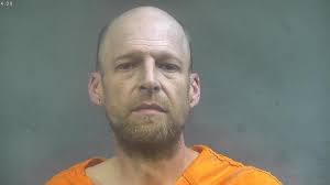 Dad charged after son is shot