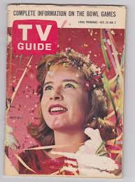 Cynthia Pepper of Margie helps TV Guide ring in the New Year for 1962.
