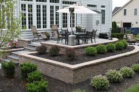 Raised Patio Using Planter Boxes And Retaining Wall By R R Caddick Landscape Raised Patio Outdoor Patio Decor Patio Landscaping