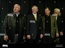 New Washington Redskins coach and team president Joe Gibbs, second from  left, gather