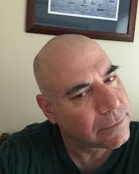 Hey! It's me. 56 year old me painted very simply 8 years ago, without  excess refinement or labor. Many artists' self portraits try to capture  some introspective deep meaning. This one is