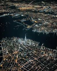 Birds Eye View Of New York City A Bird S Eye View Of Lower Manhattan At Night Looking West Over The Hudson River And New Jersey In The Background Beholdingeye Vi Nyc At Night City Aerial