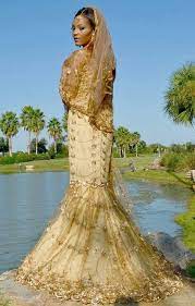 A nubian bride preparing for her traditional wedding ceremony with her family. Related Image With Images African Wedding Dress Affordable Wedding Gown African Inspired Wedding