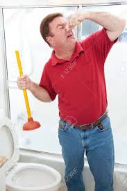 Toilet plungers — everyone needs one. Plumber Or Homeowner Disgusted By Having To Plunge Toilet And Stock Photo Picture And Royalty Free Image Image 19809636