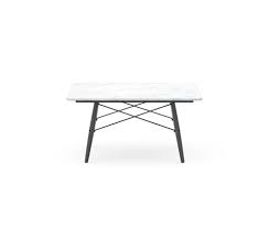 Tapered pin style legs elevate a richly grained table top with flared ends. Vitra Eames Coffee Table Selig Wohndesign