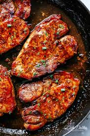 Thin boneless pork chops wraped in bacon with a touch of kc masterpiece bar b q saucesubmitted by: Easy Honey Garlic Pork Chops Cafe Delites