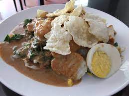 Process garlic, peanuts/peanut butter, a half part of coconut milk, red chilies, terasi, coconut sugar in a food processor or blender. Gado Gado Wikipedia