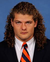 Auburn linebacker Jake Holland plans to donate long locks to charity