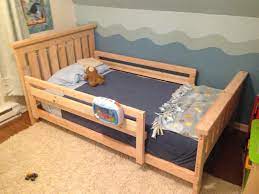 Then i put the footboard in place resting it directly on the flat 2x4s and clamped the pieces together. Diy 2x4 Bed Frame Howtospecialist How To Build Step By Step Diy Plans Diy Toddler Bed Toddler Twin Bed Kids Bed Frames