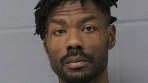 Man arrested at bus stop in connection to E Austin homicide