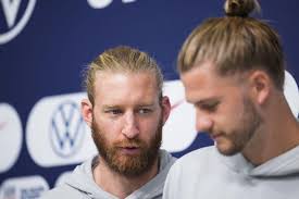 Tim Ream, left, and Walker Zimmerman, both of the United States, attend a  press conference before a team practice at Al Gharafa SC Stadium, in Doha,  Qatar, Sunday, Nov. 27, 2022. (AP