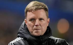 Michael Essien chases opponent around the pitch after he boots ball at him