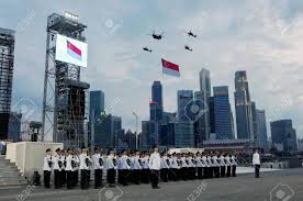 It is a public holiday, being one of ten observed nationally each year. Singapore July 04 State Flag Fly Past And National Anthem During Singapore National Day Parade 2009 Combined Rehearsal At Marina Floating Platform July 04 2009 In Singapore Stock Photo Picture And Royalty Free Image Image 35674257