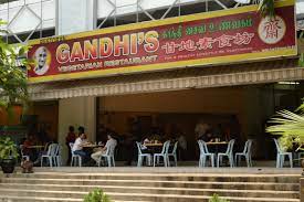 Sathiyanery vegetarian food centre, brickfields kuala lumpur , a plate of rice with a few types of vegetarian dishes, a bowl of dahl, a bowl of dessert and a glass of cold water, vegetarian banana leaf meal, vegetarian set, vegetarian chicken varuval. Gandhi S Restaurant Brickfields Eats