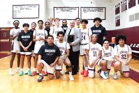 Rosario honored ahead of Dunkirk's 79-76 OT win against the Trojans