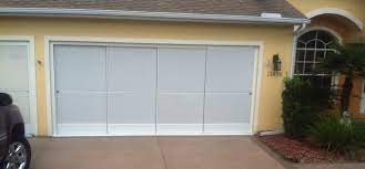 There are a total of 4 tiny wheels on your the blaster garage door lubricant is silicone based and adds the extra promise that dirt won't insert the sliding screen door onto the top track at an angle. Sliding Garage Screen Doors Garage Screen Enclosures
