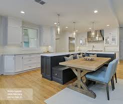 Use white for the furniture and walls, which will make the room look a lot bigger than it actually is. Kitchen Featuring An Island With Bench Seating Omega