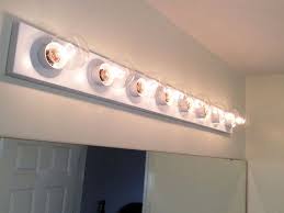 Update A Hollywood Strip Light Fixture Spray Painting Light Fixtures Brass Light Fixture Light Fixture Makeover