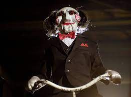 Amanda puts a necklace gadget full of explosives around dr. 15 Spooky Secrets About The Saw Franchise E Online