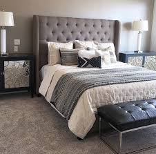 A Grey Tufted Fabric Headboard Pairs Perfectly With Leather Metals And Glass Accents Gray Upholstered Headboard Fabric Headboard Bedroom Grey Headboard