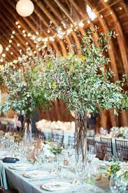 Rustic Barn Tall Wedding Centerpieces With Olive Branch Greeneryweddings Weddingdec Branch Centerpieces Wedding Branch Centerpieces Tall Wedding Centerpieces