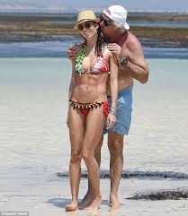 Pubblicato da unknown a 17:07. Flavio Briatore 64 Kisses Wife Elisabetta Gregoraci 34 On Kenyan Beach As She Displays Trim Figure In Pom Pom Clad Bikini Daily Mail Online