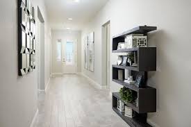 Attention Grabbing Bookcase And Mirrored Wall Art Paige Model Home Entry Las Vegas Nevada Richmond American Homes Home New Home Builders Richmond Homes