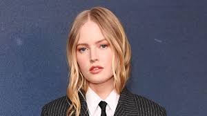Ellie Bamber cuts a sophisticated figure in an androgynous black pinstripe  suit and tie as she attends the William Tell premiere in London