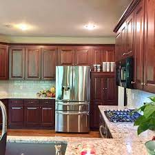 There are different approaches to restaining your kitchen cabinets, depending on your desired results. Cabinet Refacing Vs Refinishing Midwest Kitchens Cabinet Refacing