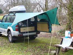 Pin By Caitlin Blevins On Camping Tarps Suv Camping Truck Bed Camping Car Awnings