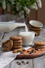 chocolate chip cookies with milk by natalia sokko cookies food milk chocolate makanan estetika kue coklat chip ide makanan