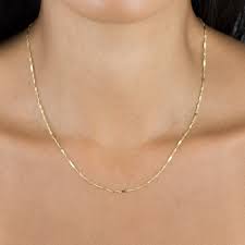 The item you've selected is exceptional and deserves special attention. Solid Bar X Singapore Chain Necklace 14k Adina S Jewels
