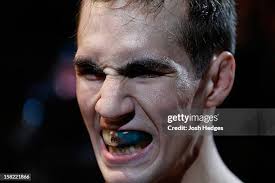 Benson Henderson delivers a kick against Nate Diaz during their... News  Photo